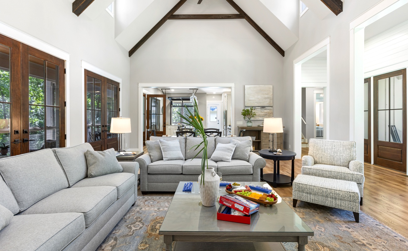 Open Living Space with High-Vaulted Ceilings and Wraparound Porch