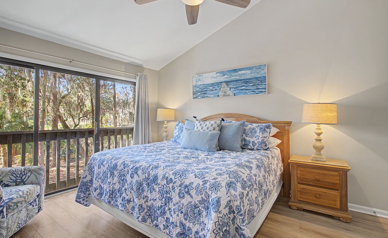 Drift off to peaceful sleep in your serene retreat, where soft blue linens and warm lighting create the perfect sanctuary.