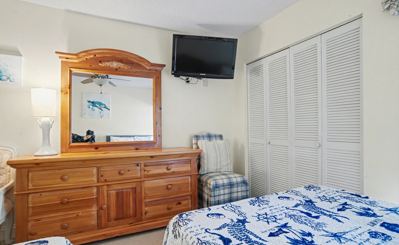 Relax in your coastal-themed bedroom with charming nautical touches, ample storage, and entertainment at your fingertips.