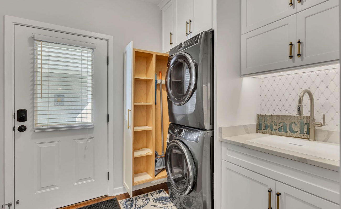 Your laundry stays fresh with these full-size washer and dryer, complete with built-in storage and a convenient utility sink.