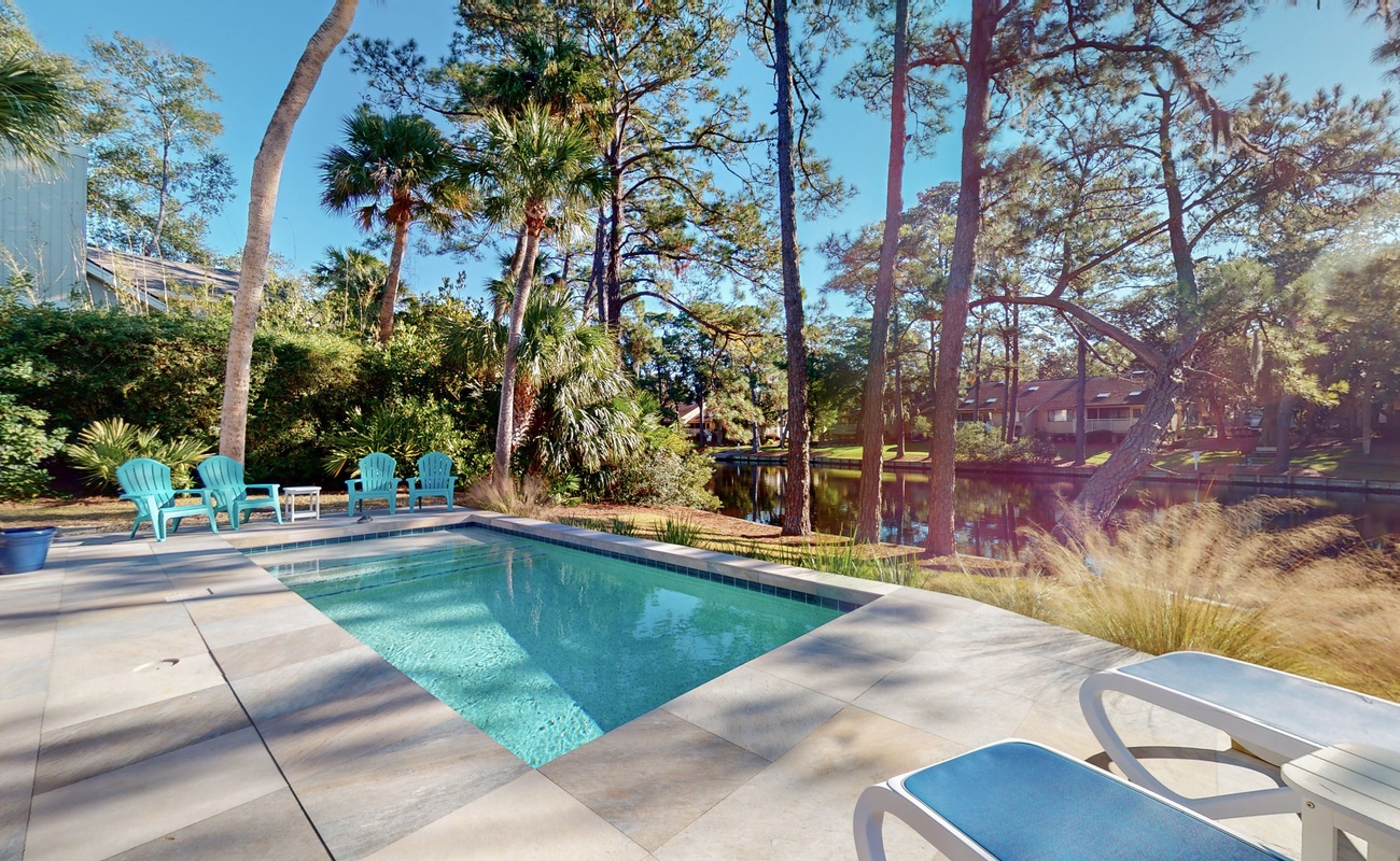 Your private pool oasis awaits, surrounded by swaying palms and lush gardens—perfect for morning swims and afternoon relaxation.