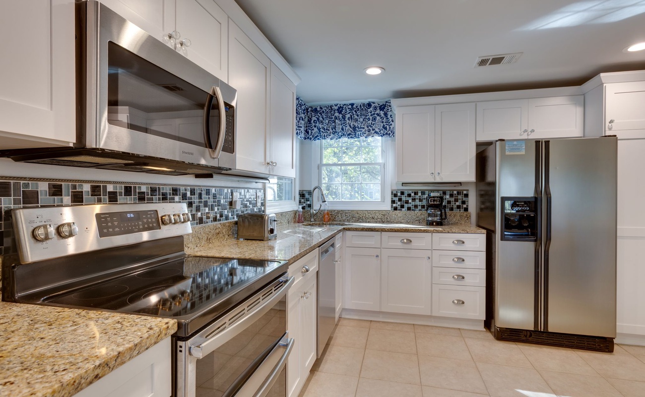 Your fully equipped kitchen features granite counters, stainless appliances, and abundant storage for creating memorable vacation meals together.