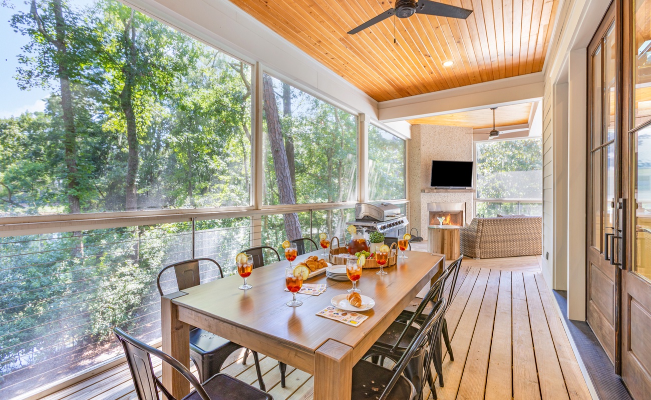 Screened Wraparound Porch with Views of Lagoon, Private Pool, and Glimpses of Golf Course