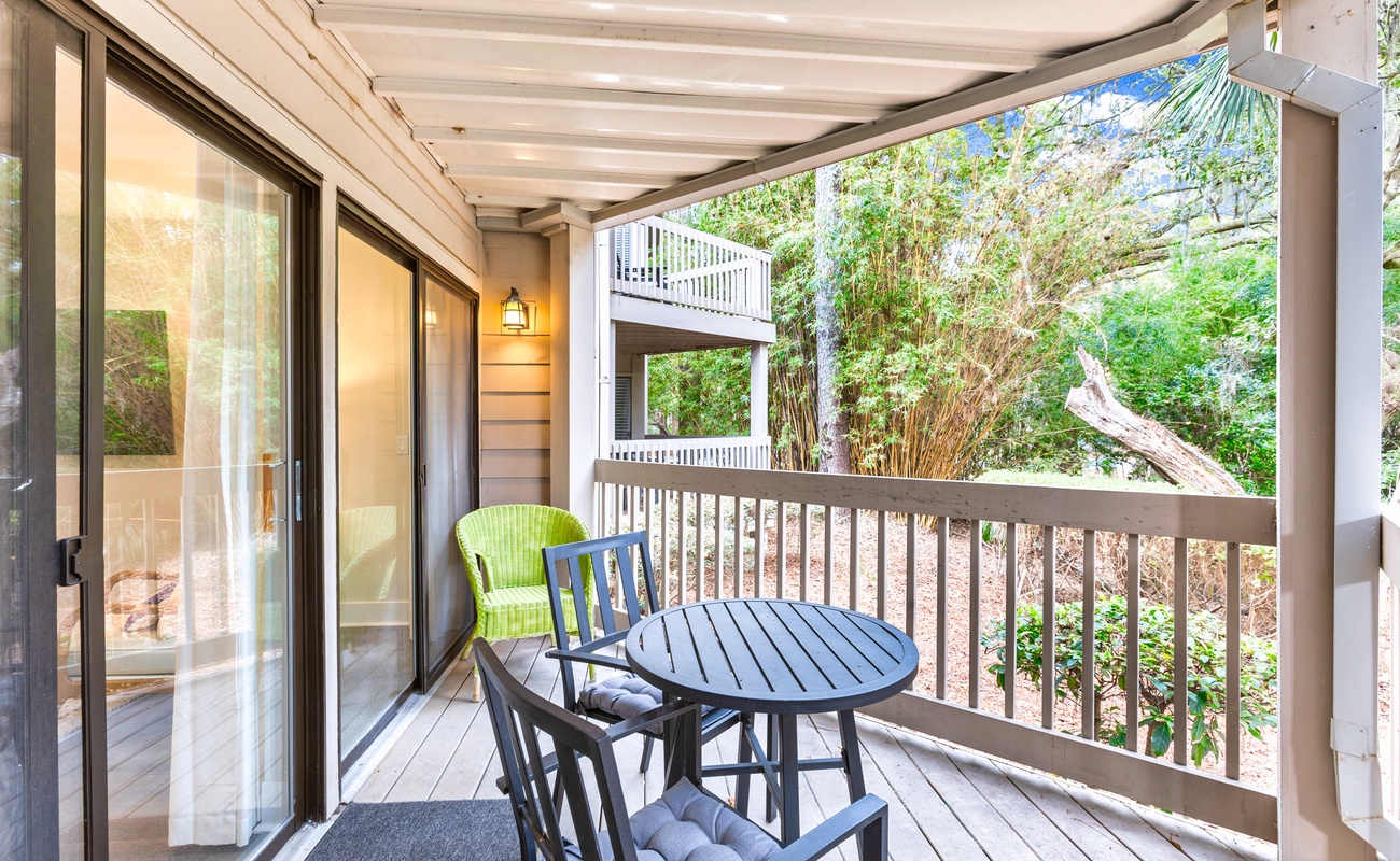 Step onto your private balcony and breathe in the fresh forest air while enjoying morning coffee at your outdoor dining table.