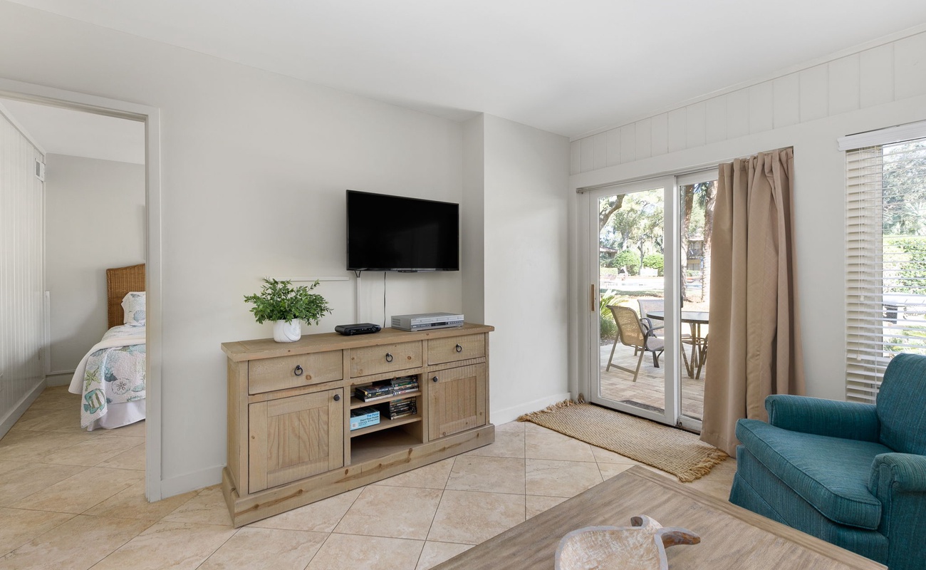 Unwind in your bright living space with modern entertainment and peaceful balcony access for your morning coffee moments.