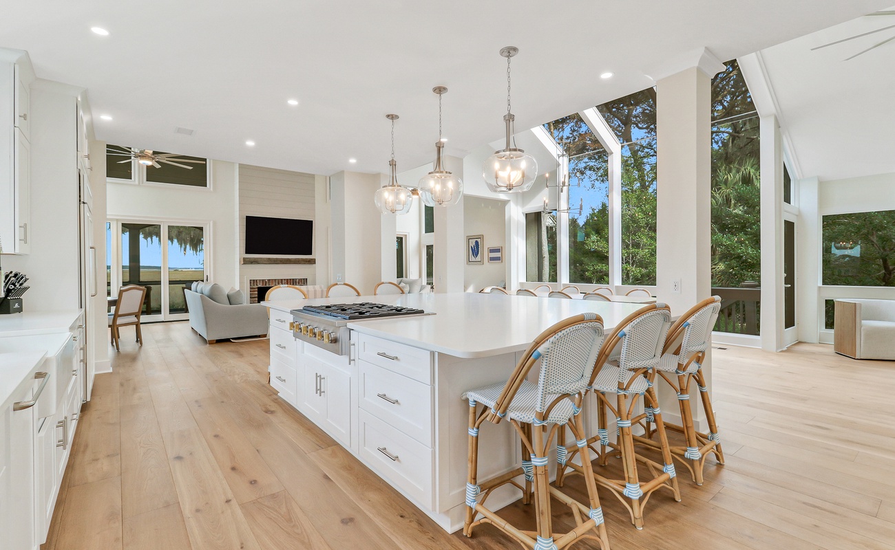 Your gourmet kitchen flows seamlessly into the living space, featuring a stunning island perfect for cooking and gathering with friends.