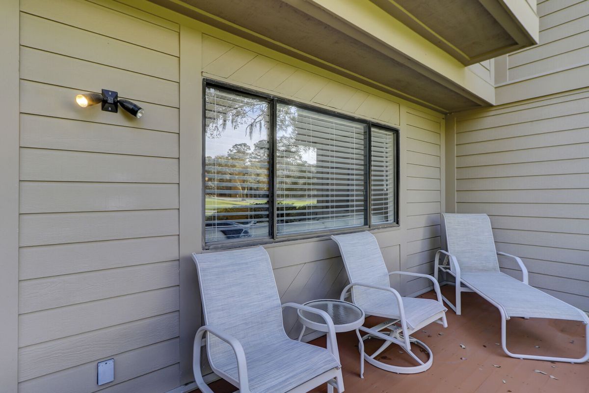 Back patio with beautiful views of Harbour Town Golf Links. Spacious and several tables and chairs make for perfect outdoor dining.