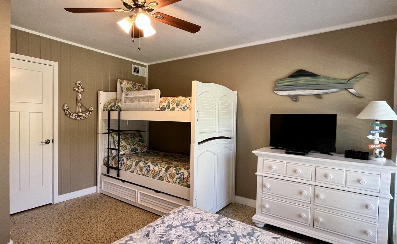 Ground Level Bedroom with Twin Bunks and Queen Bed