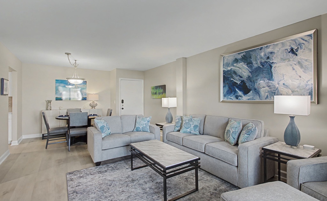 Relax in your stylishly appointed living space where soft gray furnishings and ocean-inspired artwork create the perfect atmosphere for unwinding after your adventures.