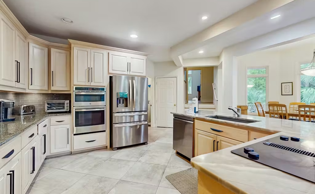 Your gourmet kitchen awaits with granite countertops, stainless steel appliances, and spacious island perfect for cooking together.