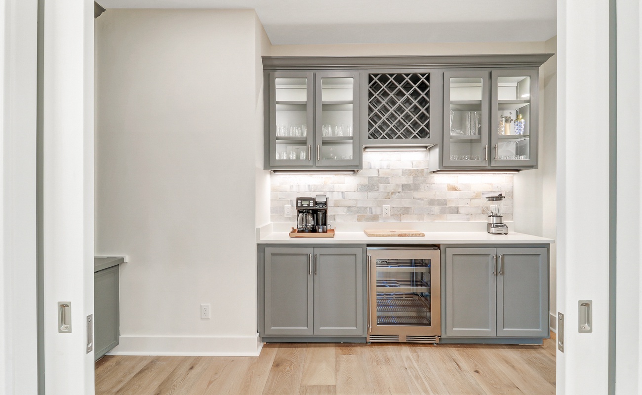 Your elegant butler's pantry features marble counters, wine storage, and coffee station—perfect for entertaining.