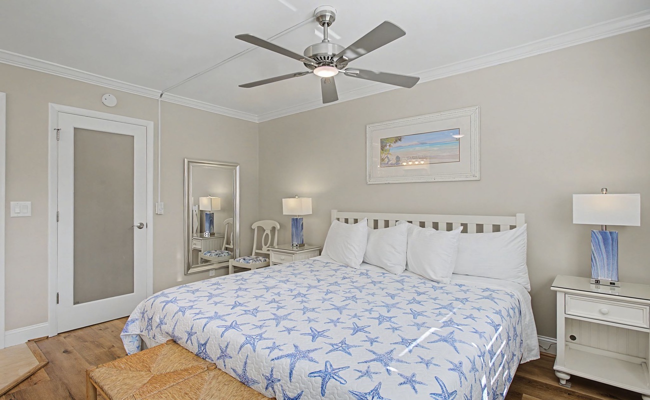 Drift off in this coastal-themed bedroom where starfish patterns and soothing blues create your peaceful seaside retreat.