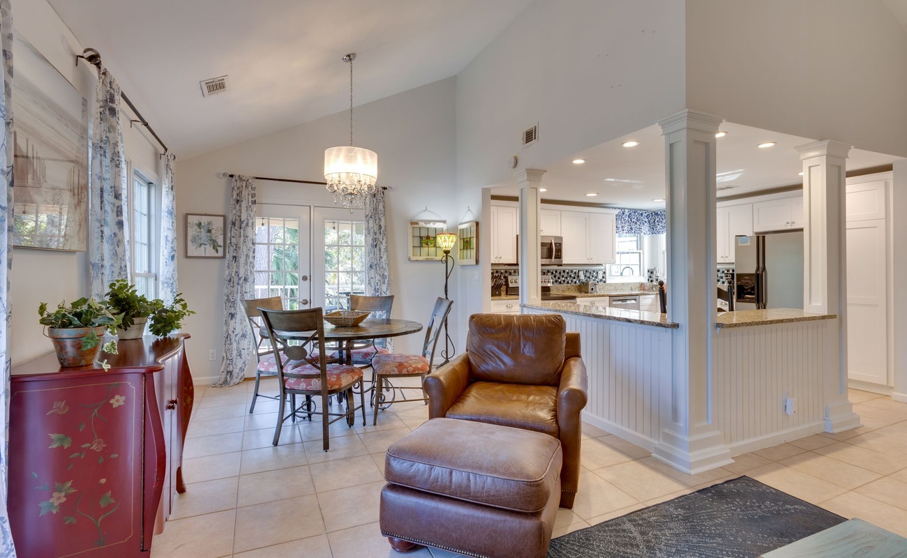 Relax in your open living space where leather seating meets elegant dining, all flowing seamlessly to your fully-equipped kitchen.