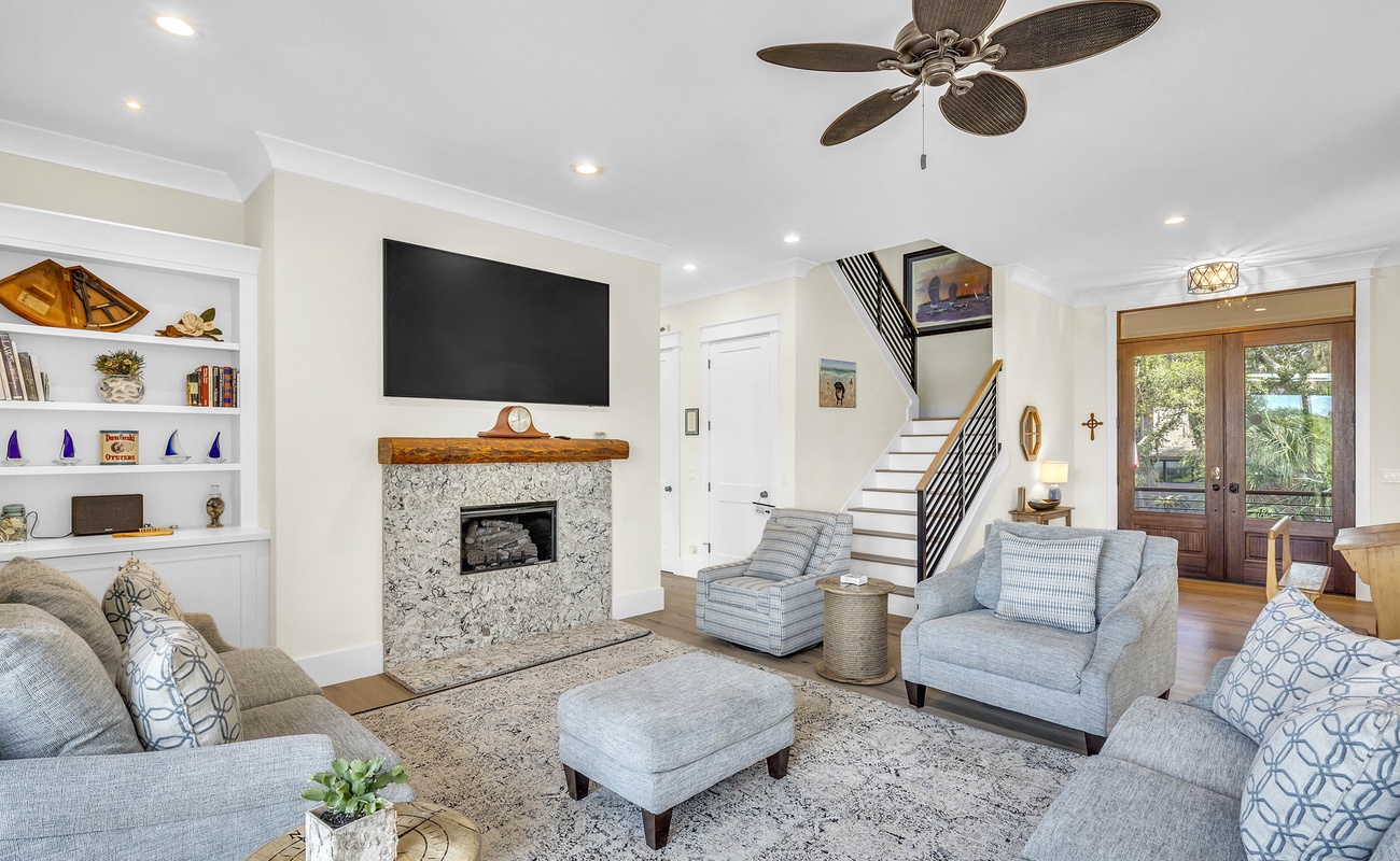 Living Area with Balcony and Hall Toward Primary Suite to the Left of Stairs