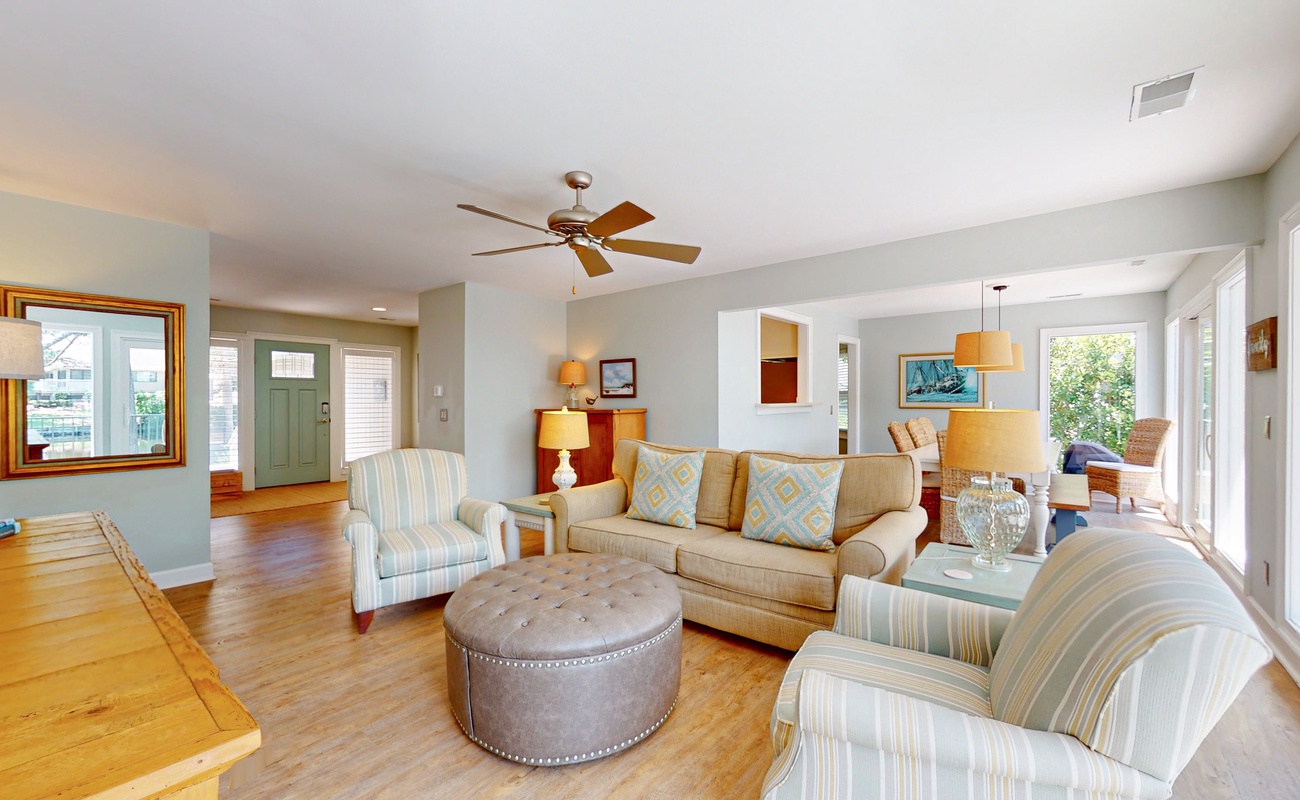 Relax in your bright, open living space with comfortable seating and warm wood floors throughout.