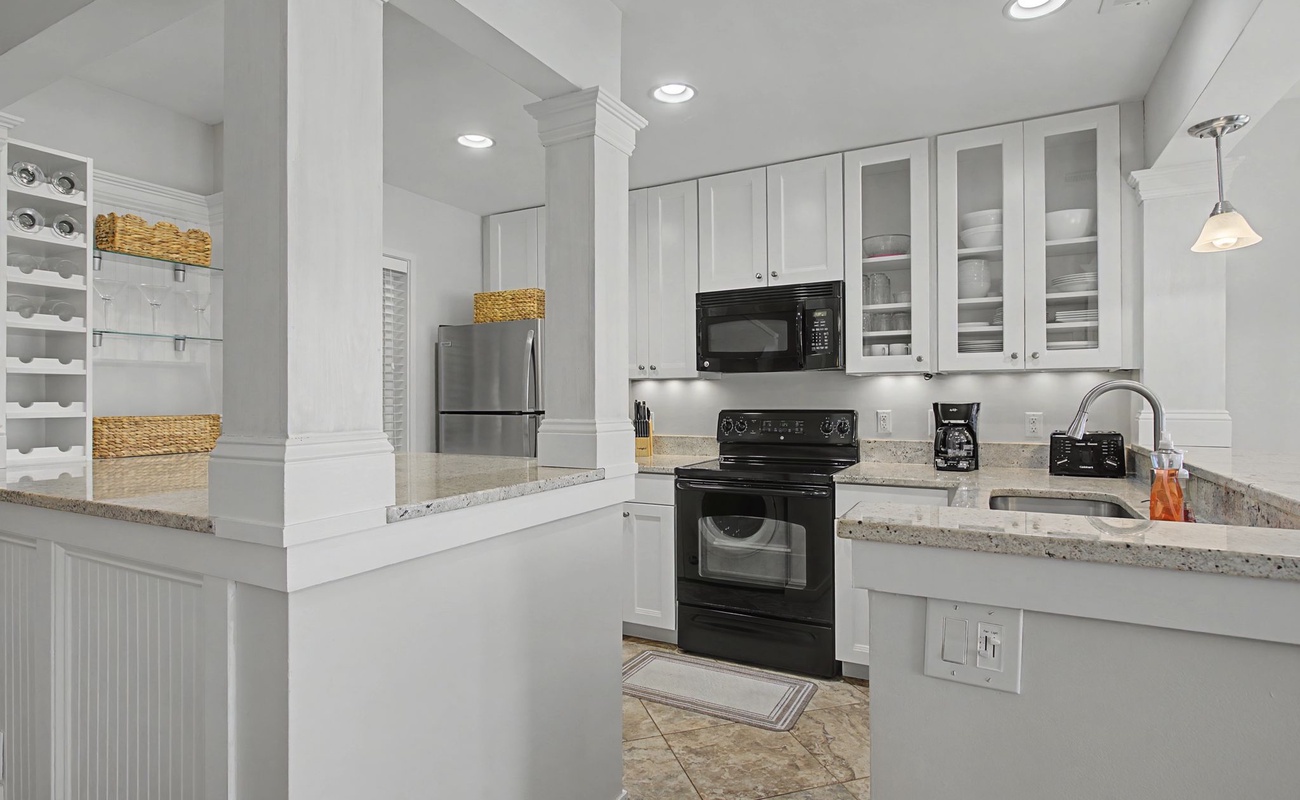 Your fully-equipped kitchen awaits with granite counters, stainless appliances, and abundant storage for creating memorable meals together.