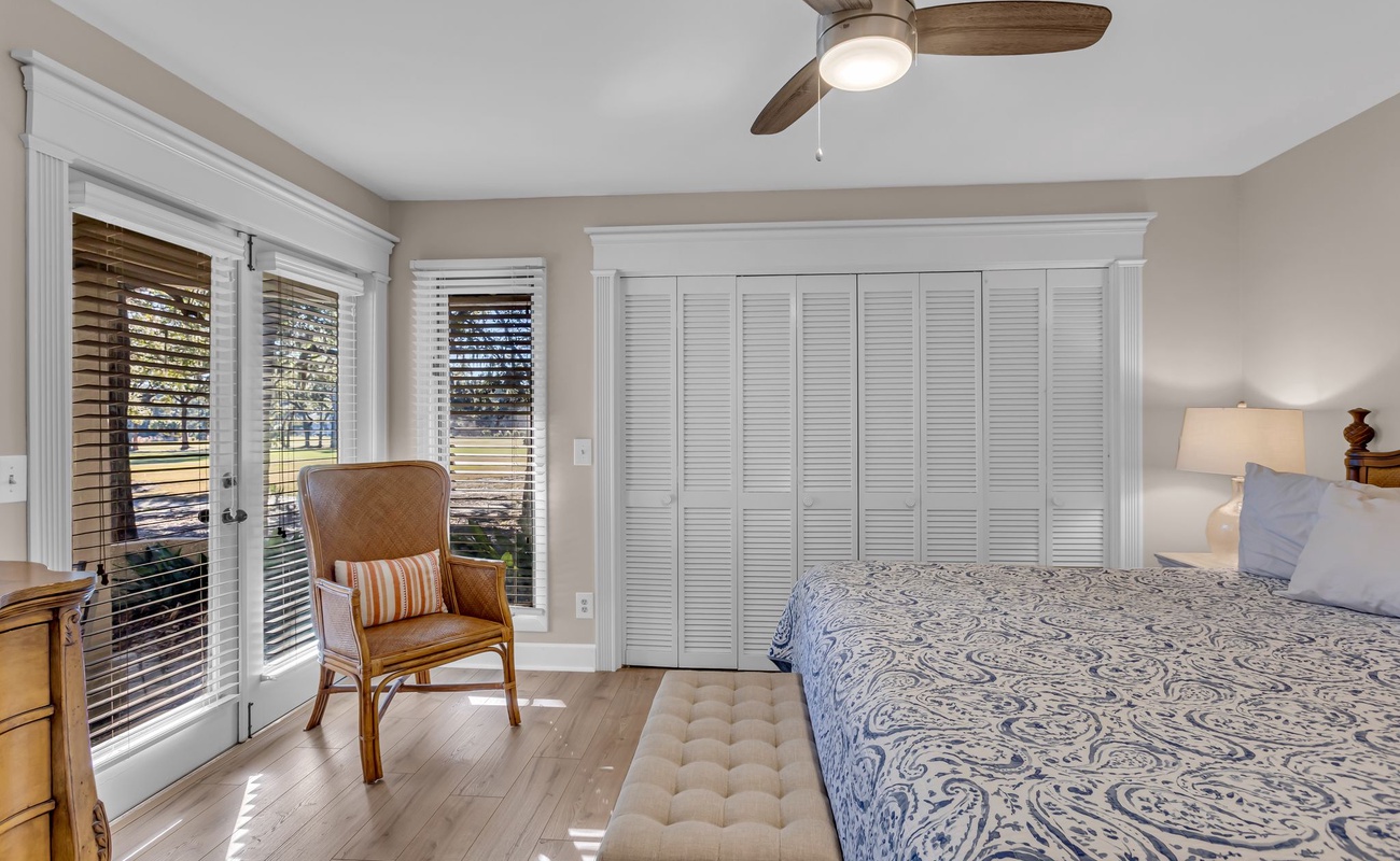 Wake up in your peaceful retreat with crisp linens, natural light streaming through elegant shutters, and your own private balcony.