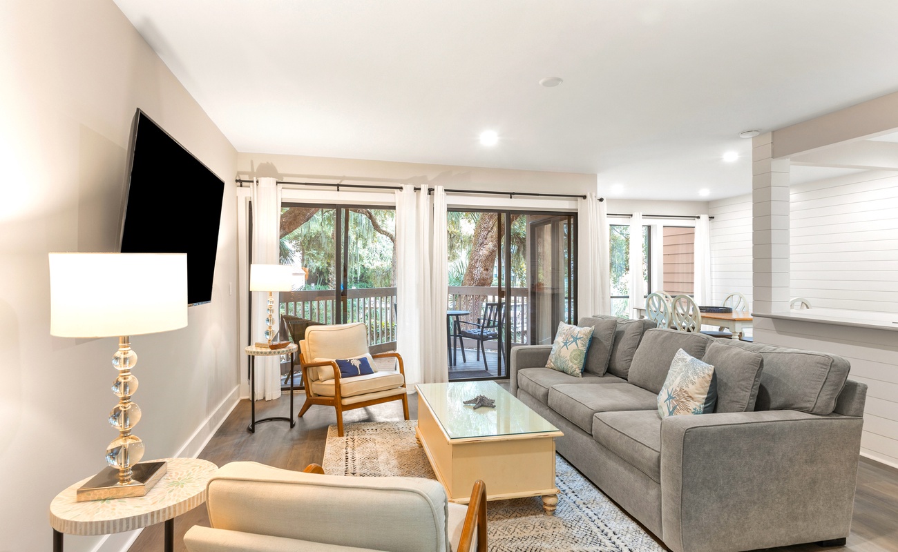 Unwind in your spacious living room with plush seating, natural light streaming through large windows, and a private balcony perfect for morning coffee.