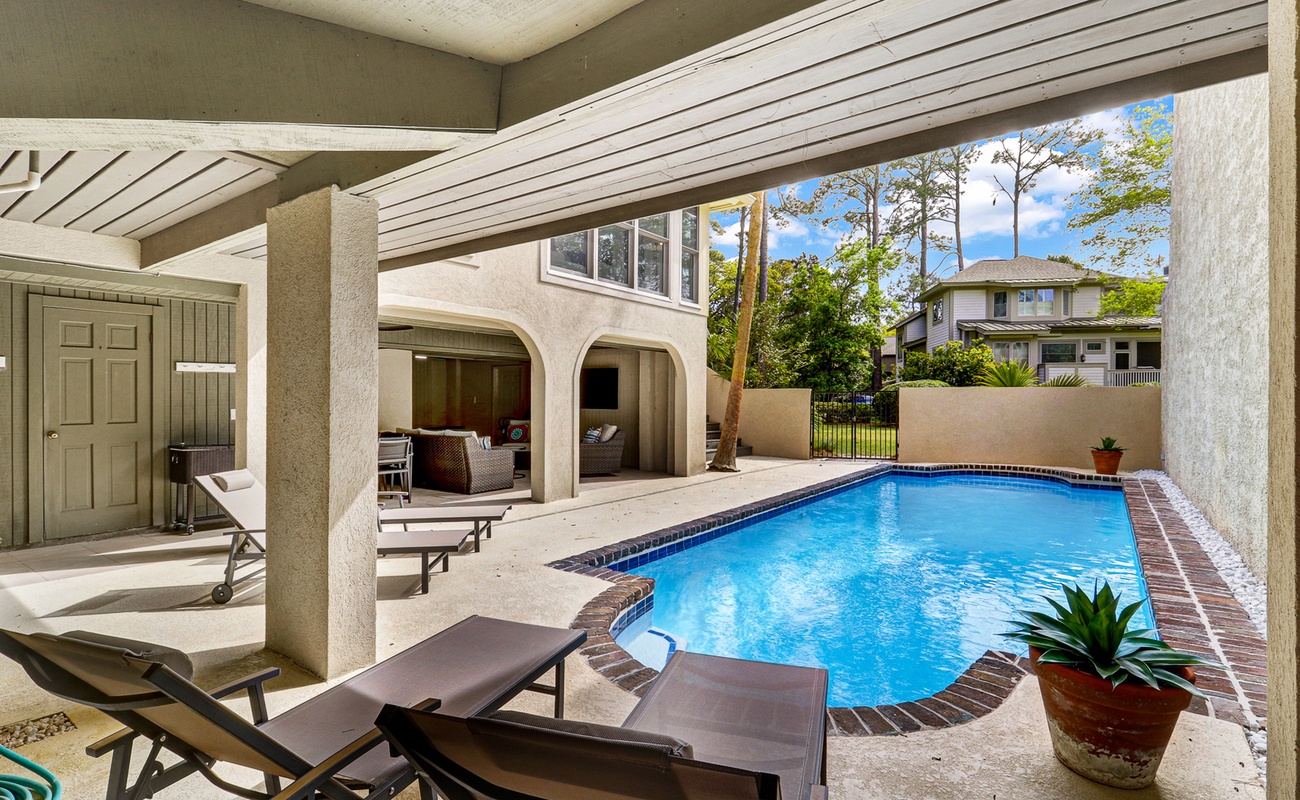 Your private pool oasis awaits, where you can lounge on comfortable chairs under the covered patio and take refreshing dips all day long.