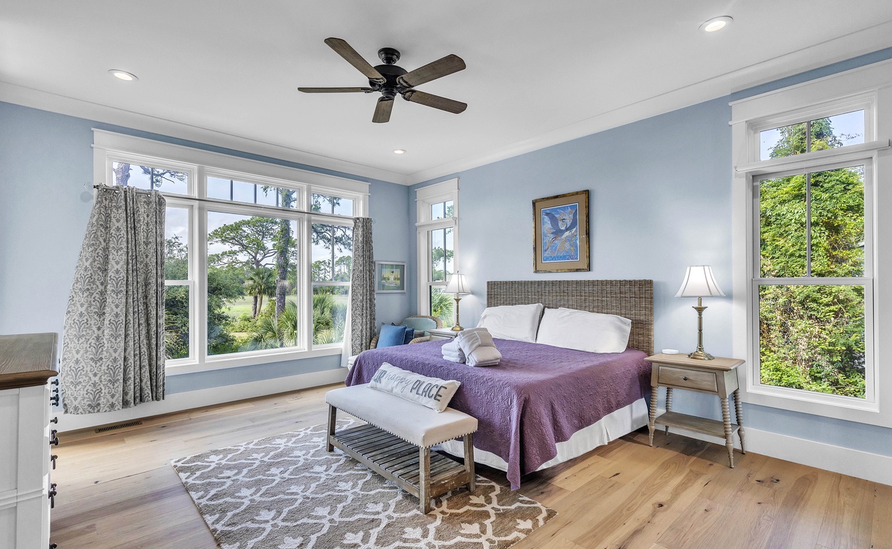 Main Floor Primary Suite with King Bed, En-Suite Bathroom, and Balcony Access