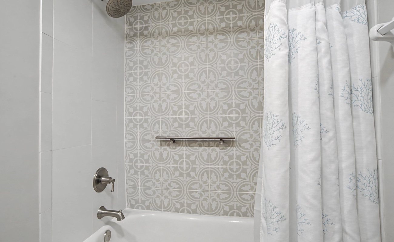 Refresh in your elegant bathroom with beautiful patterned accent tiles and a deep soaking tub perfect for unwinding after exploring.