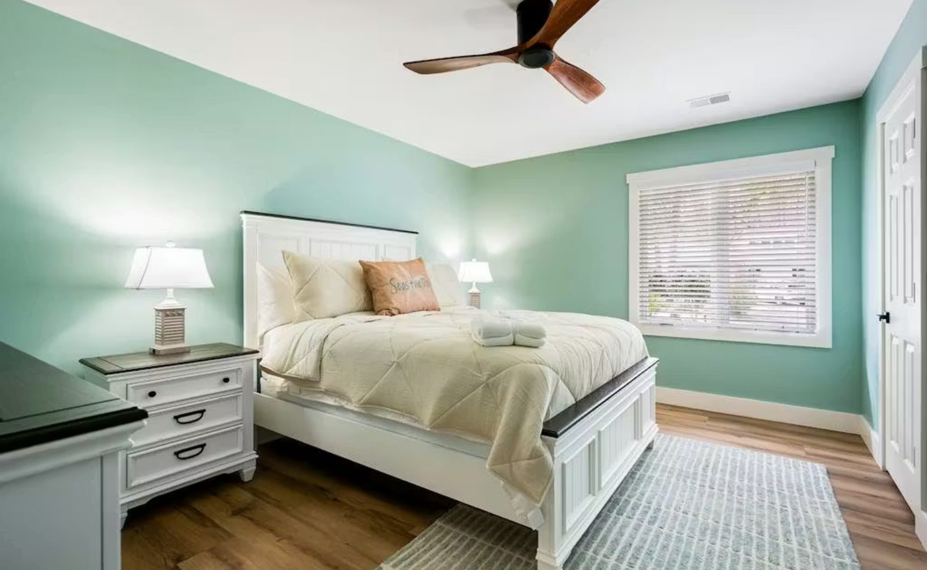 Drift off in your serene seafoam sanctuary, where coastal colors and crisp linens create the perfect escape for restful nights.