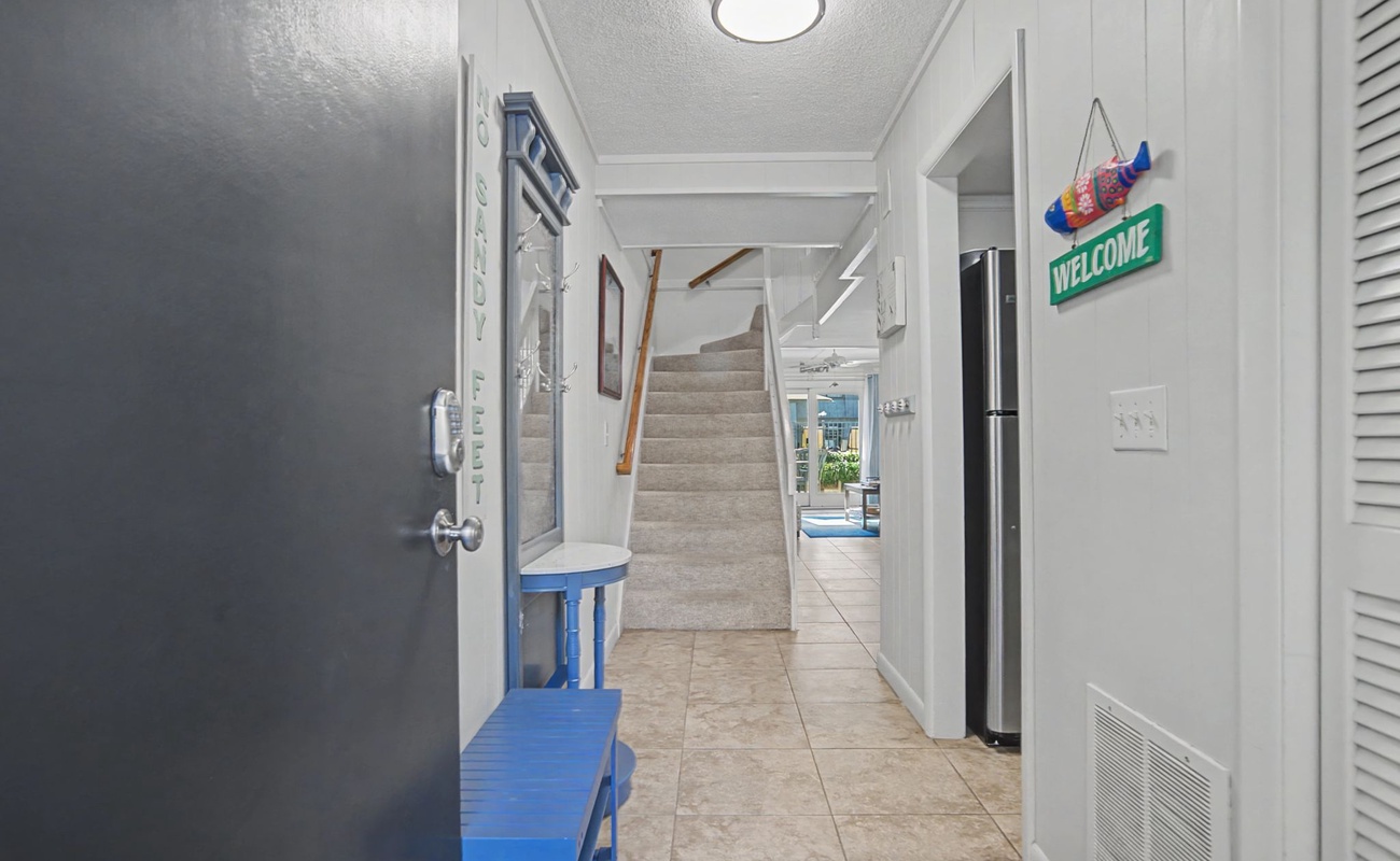 Step into your welcoming hallway, where bright coastal vibes and thoughtful touches create an instant sense of home.