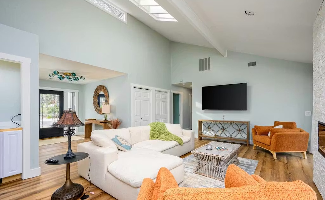 Sink into the plush sectional sofa and soak up natural light from your private skylight in this airy living space.