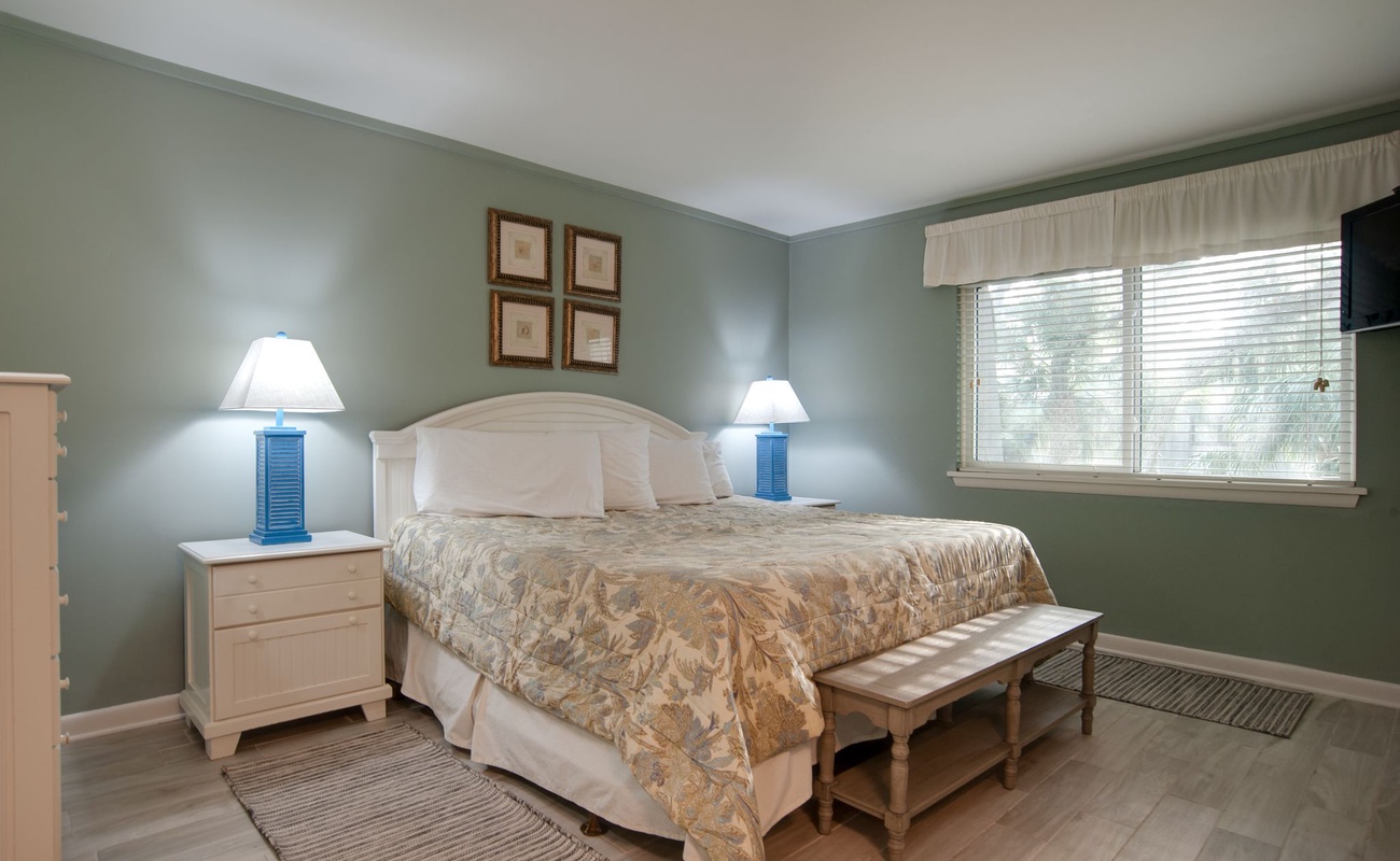 Drift into peaceful dreams in your serene bedroom, where soft sage walls and coastal touches create the perfect sanctuary for rest.