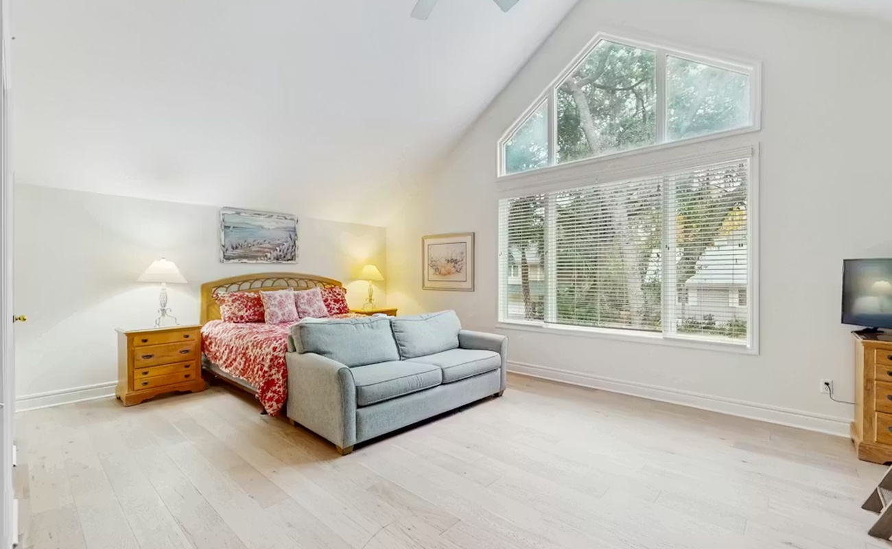 Relax in your bright, airy bedroom with soaring ceilings and peaceful views streaming through generous windows.