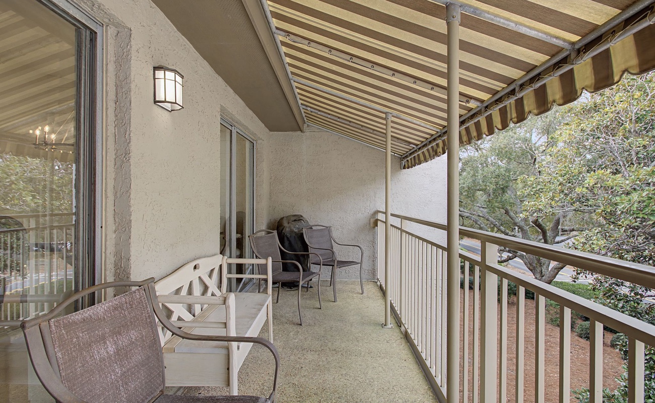 Relax on your private covered balcony with comfortable seating, perfect for morning coffee or evening unwind time.