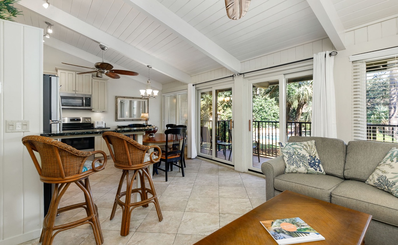 Relax in your bright, open-concept space where coastal charm meets comfort—perfect for morning coffee at the breakfast bar or evening gatherings.