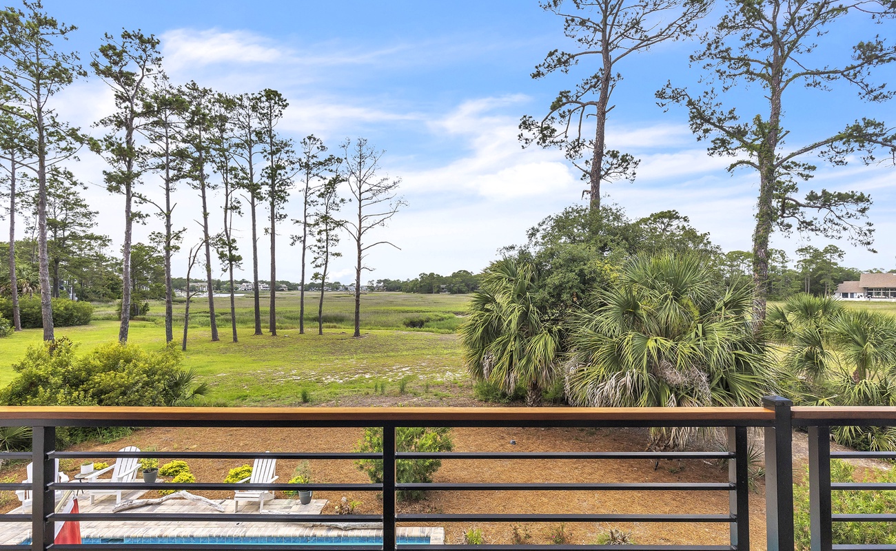 Balcony View of Pool and Marshland