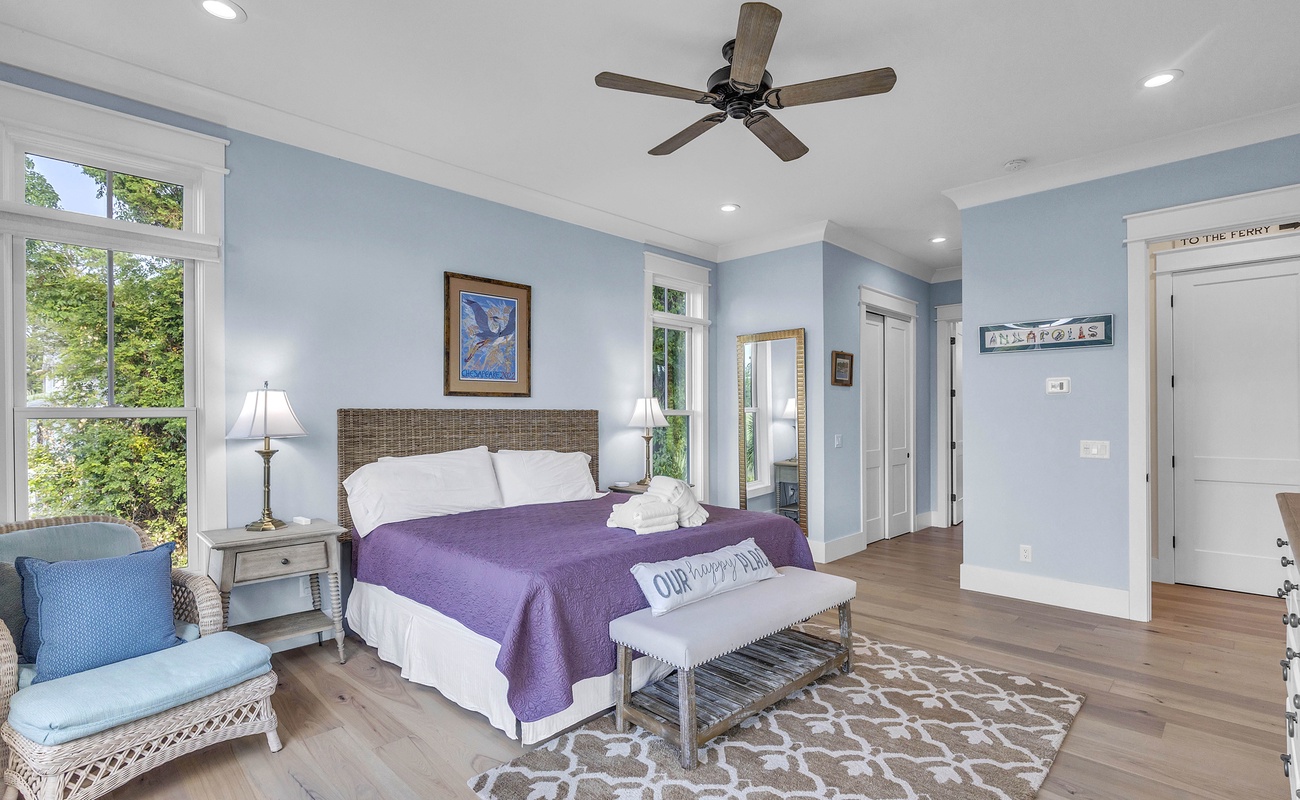 Main Floor Primary Suite with King Bed, En-Suite Bathroom, and Balcony Access