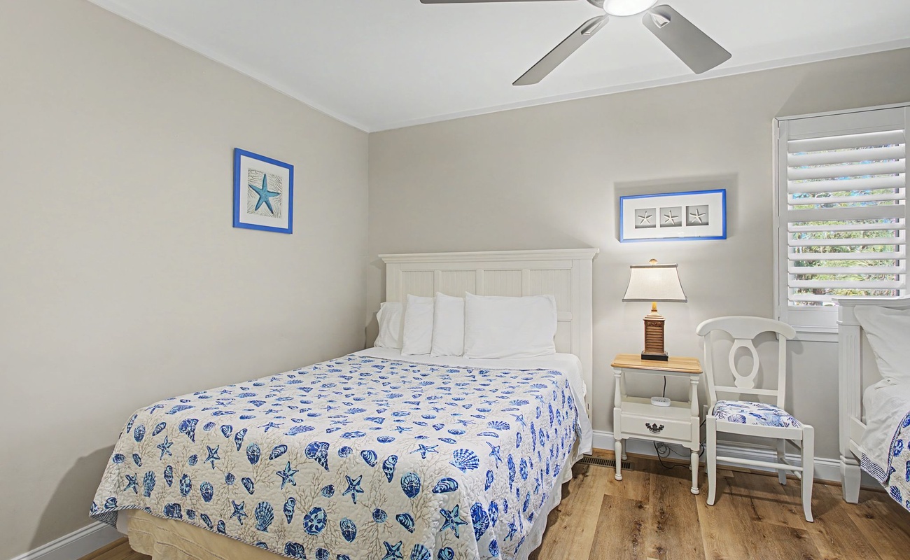 Drift off in your charming coastal bedroom with ocean-themed linens and soothing sea-inspired decor creating the perfect beachside retreat.