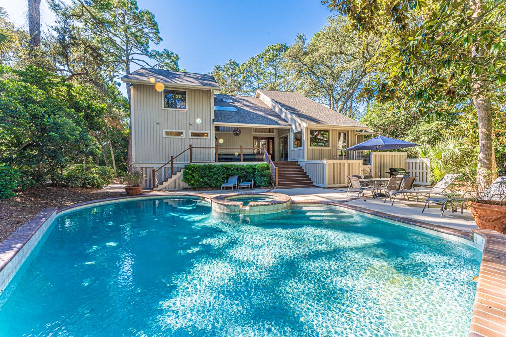 Back of the house and pool area at 24 Red Cardinal