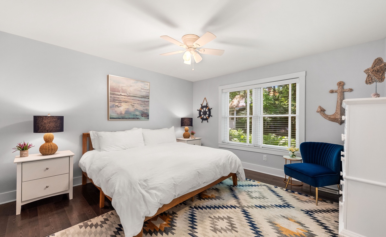 Primary bedroom is on the main level & has a king-sized bed.