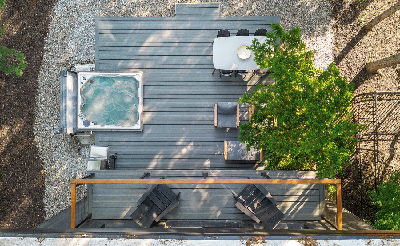 Luxe lounging, bubbling hot tub, and dinner under the trees.