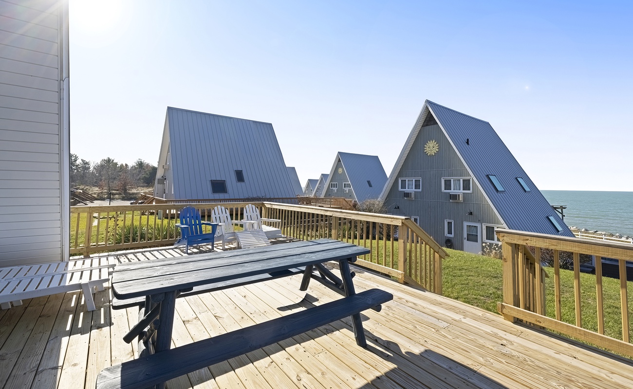 Enjoy sunny lounging and lakeside living on the deck.