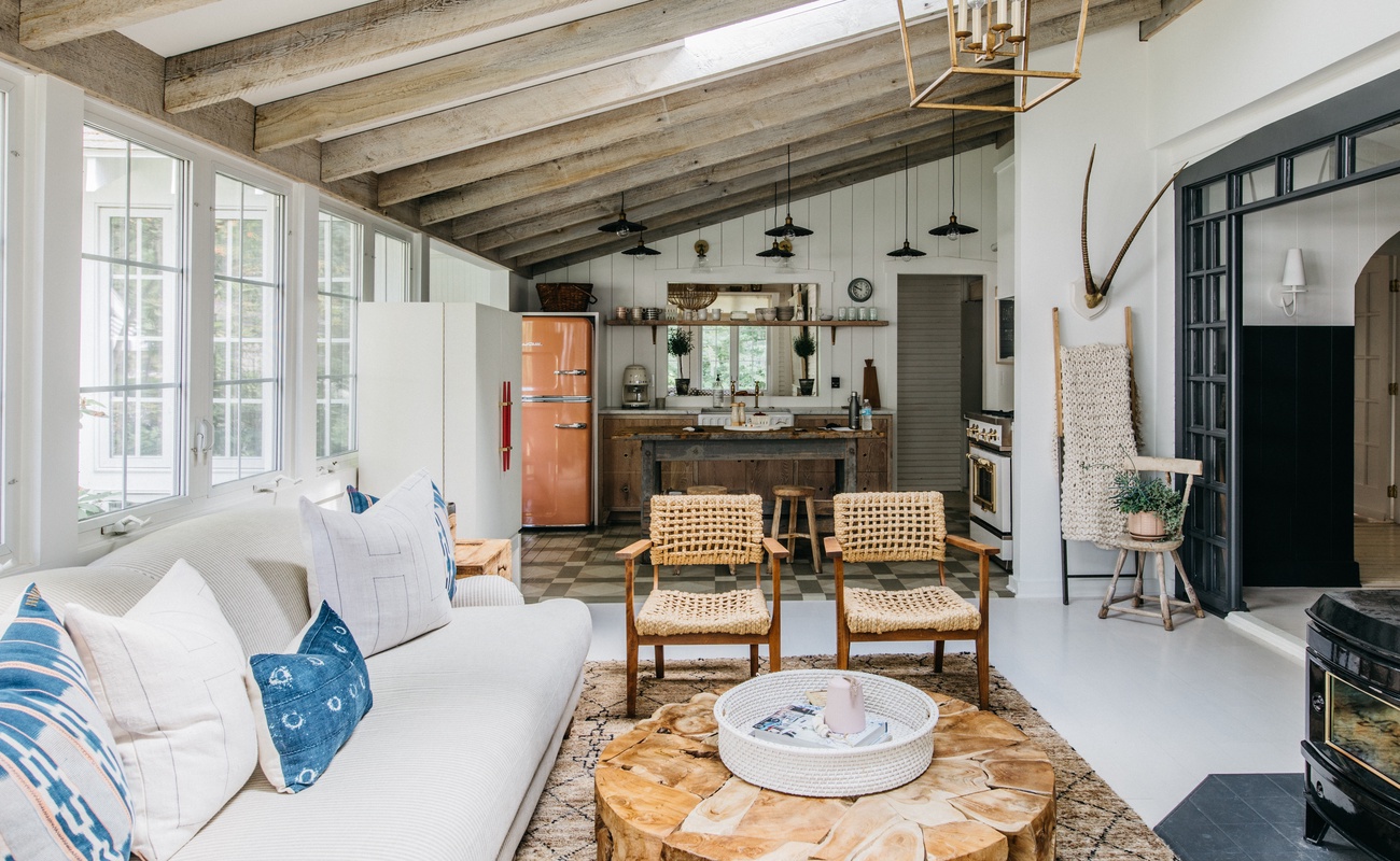 The main living area features vaulted ceilings and rustic exposed beams.
