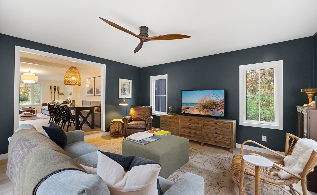 The den flows into dining, connecting calm and conversation.