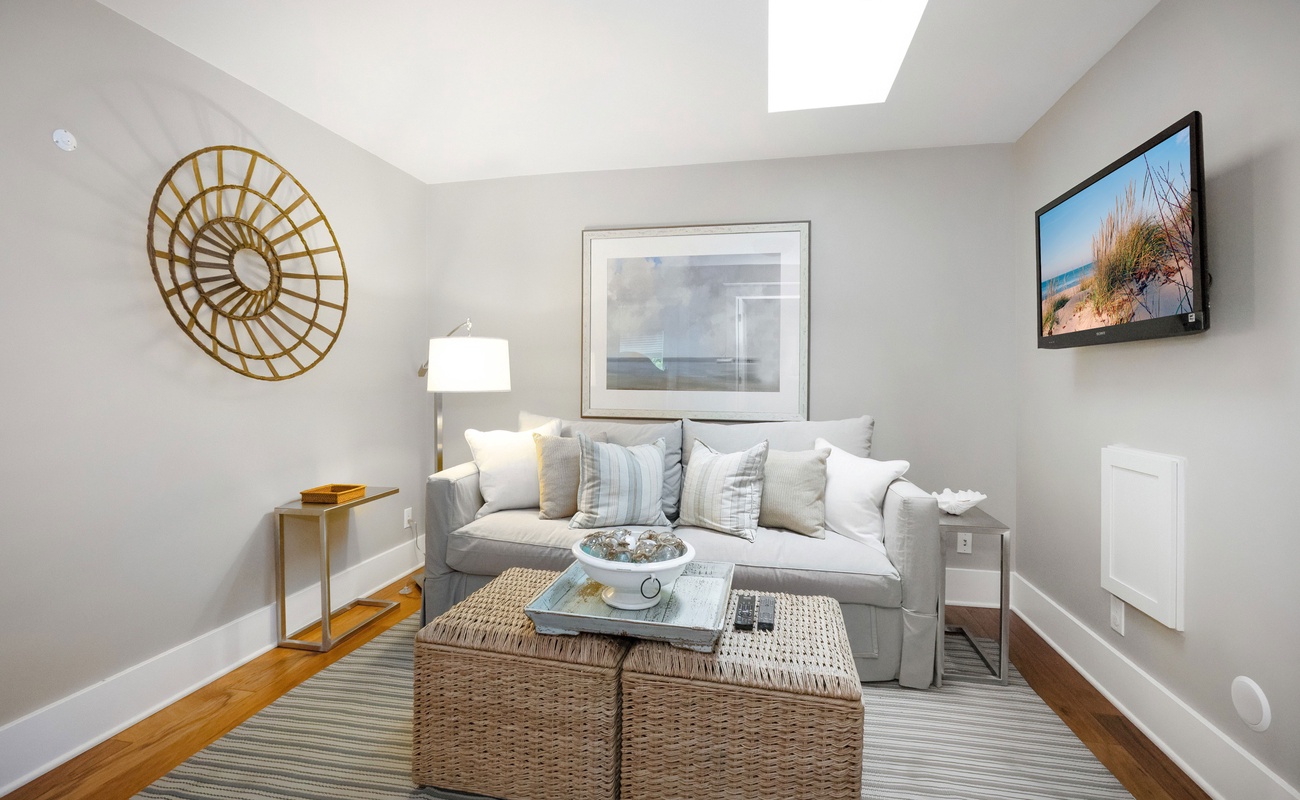 The main floor has a nicely appointed sitting room with a flat-screen TV. Chill?