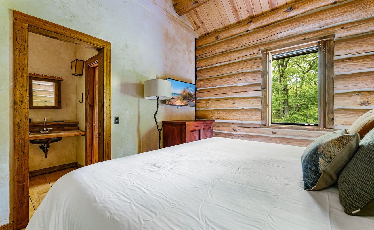 A king bed and inspiring views make this bedroom pure luxury living.