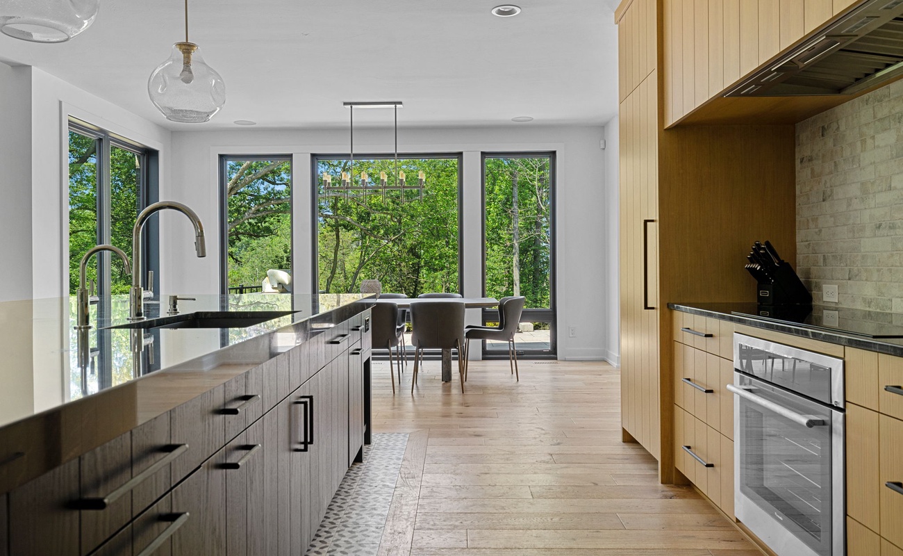 Inviting kitchen with a stunning island and charming wooden floors - the heart of the home.