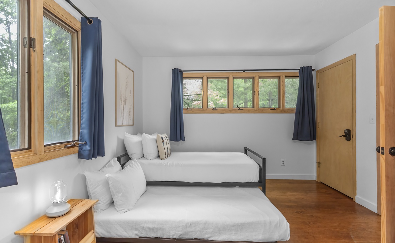 Light-filled twin room with trundle for extra flexibility.