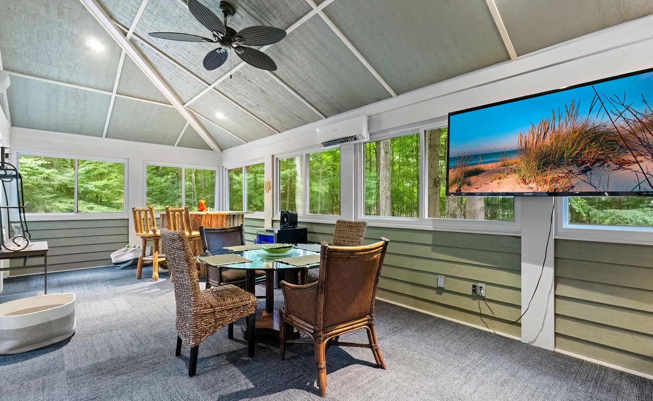 A 3-Seasons Room with all sorts of cool stuff - a custom wood-log bar included.