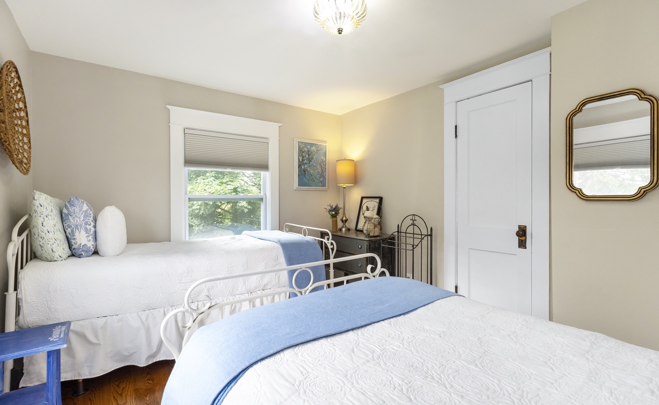 Sweet twin beds, soft blues, and vintage charm throughout.