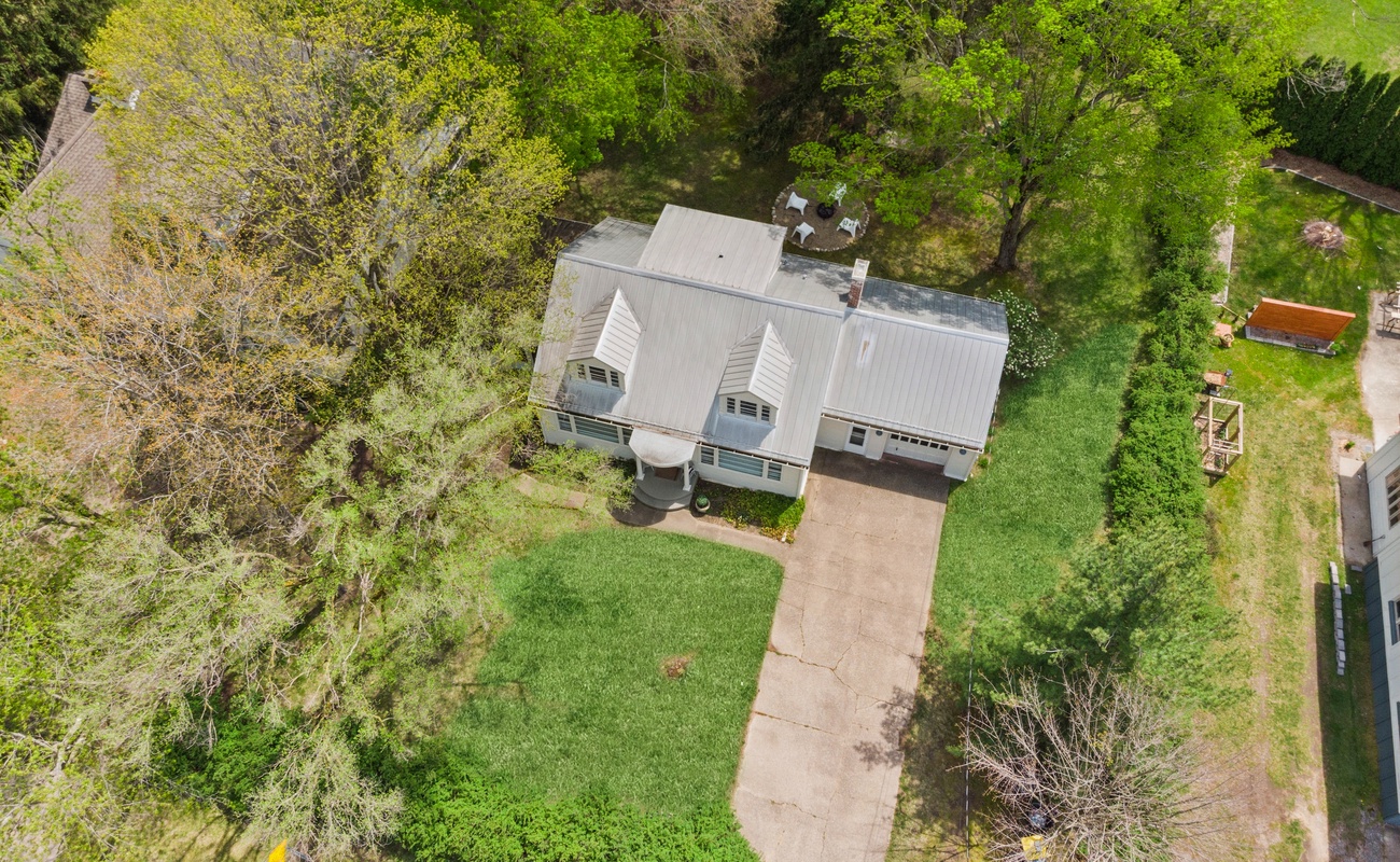 Classic charm and a spacious yard, captured from above.