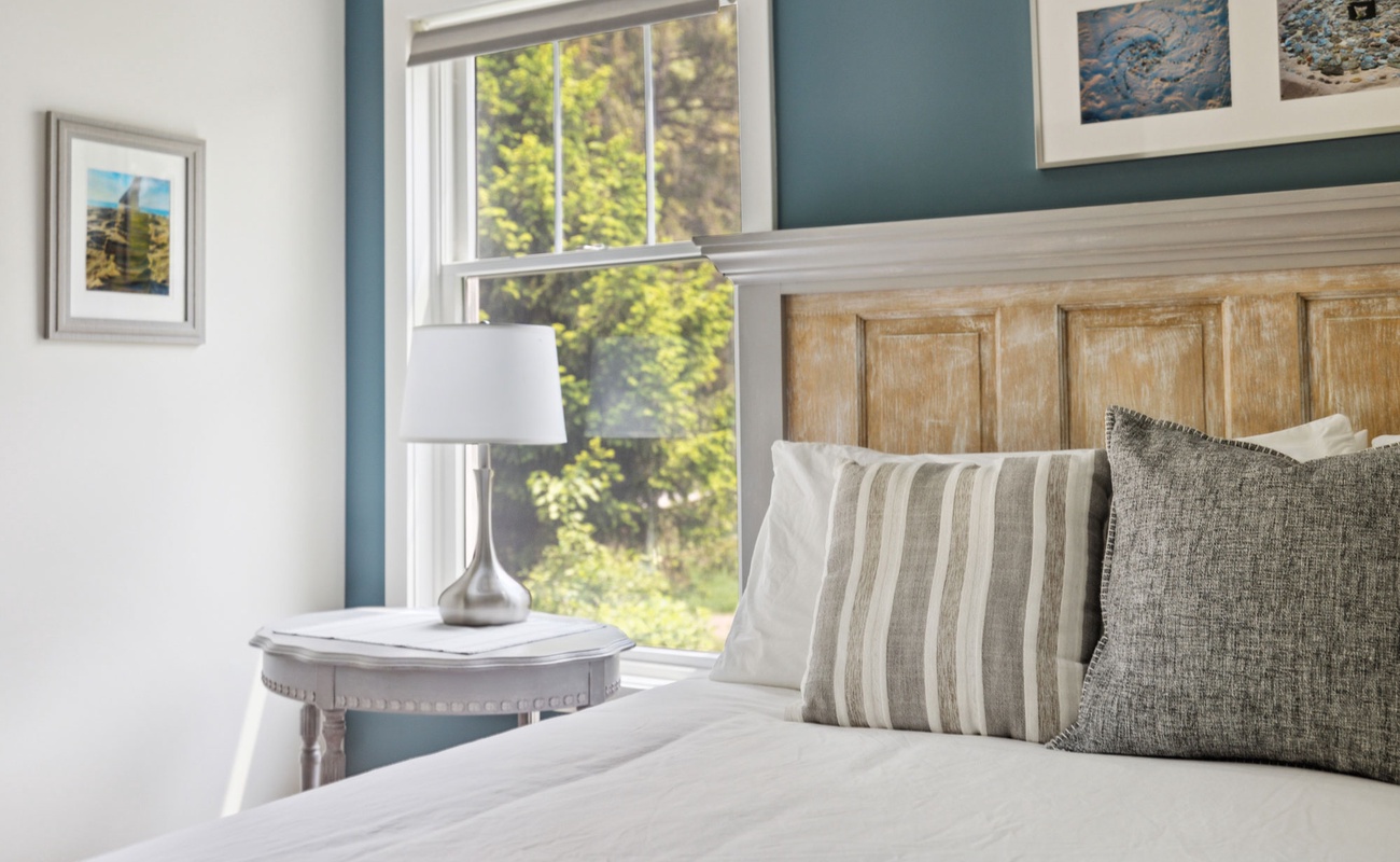 Primary bedroom is on the main level & has a king-size bed.