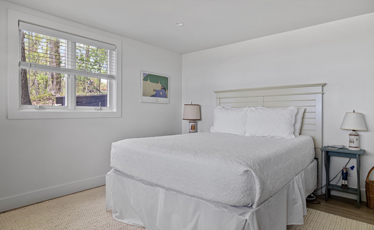 Bedroom 6 is on the main level & has a queen-size bed.